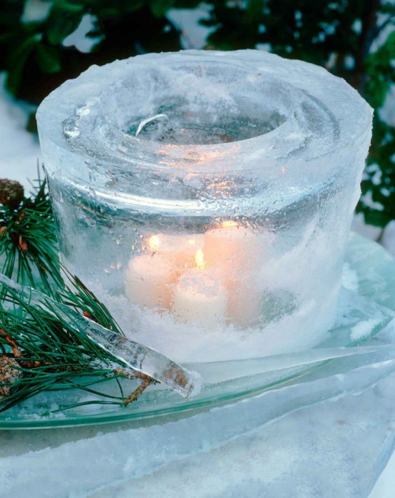 a large glass-shaped ice luminarie with several candles looks more spectacular and bright than a usual one