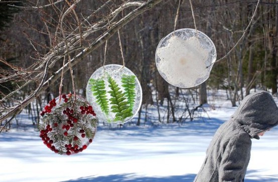 Christmas ice wreaths with berries, greenery and a flower inside are amazing for styling your garden for winter and Christmas