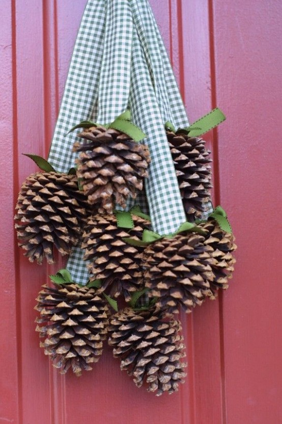 a fall decoration of pinecones hanging on gingham ribbons is a nice and simple idea that can be easily and fast DIYed