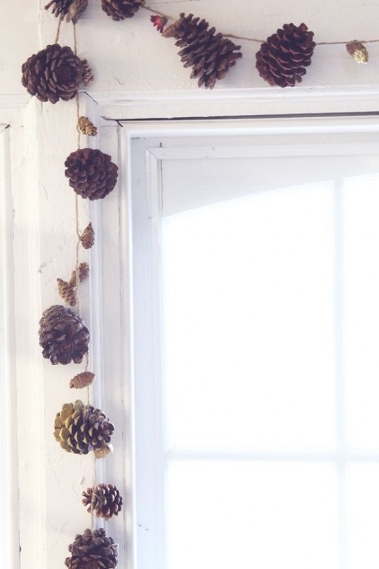a fall garland of larger and smaller pinecones and dried blooms is a cool idea for rocking in any space in the fall