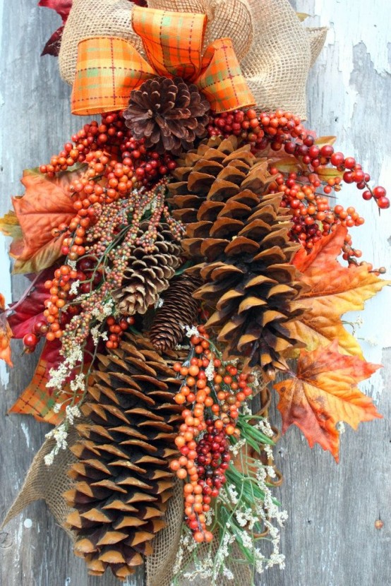a fall decoration of large pinecones, leaves and berries and bright plaid and burlap bows will bring a bold touch to your space