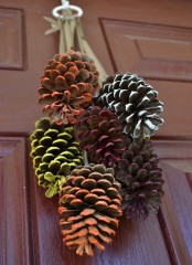 a decoration composed of bright painted pinecones is a bright and fun idea for the fall