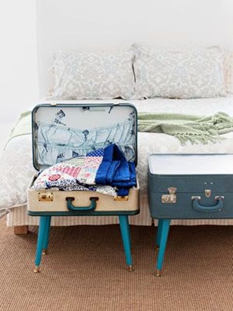 vintage suitcases placed on legs are great storage units for your bedroom, they can hold a lot of stuff and look cool