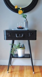 skip a usual console table and make your own one of a vintage suitcase and some legs adding a shelf and your space will be more personalized