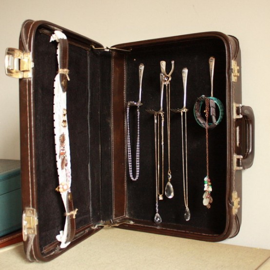 a small vintage suitcase repurposed into a jewelry case is a lovely idea for a refined vintage space