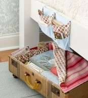 a half of suitcase on casters works as a storage drawer under your bed, chair or some other pieces