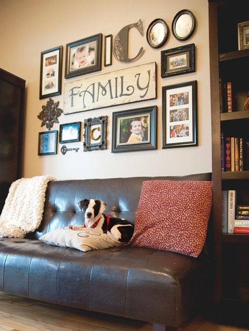 a vintage-inspired gallery wall with sings, photos, mirrors - all of them in matching vintage frames and vintage keys