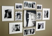 an elegant gallery wall with black and white photos in vintage white frames and without frames is stylish