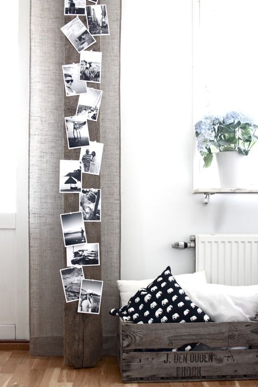 a wooden beam with lots of black and white photos from holidays will inspire you and fill with good memories