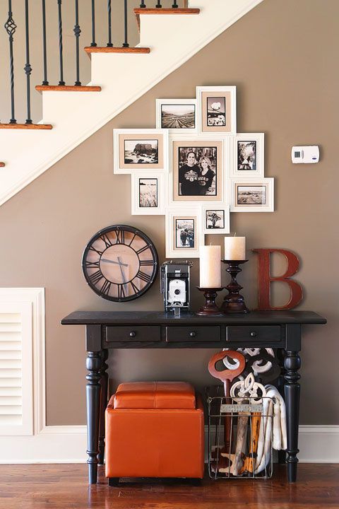 a stylish vintage inspired gallery wall with black and white photos in white frames is elegant and chic