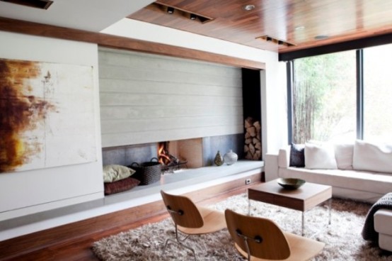 store your firewood next to the fireplace, in a niche on one side, this is a very modern and cool idea to hide it