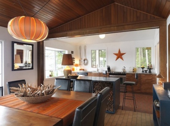 a kitchen island holding firewood is a fantastic idea for a fireplace or a hearth, it adds a cozy touch to the space