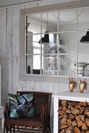 a console table with firewood stored inside is a very cozy rustic idea for any kind of space