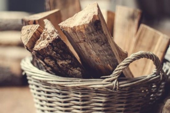 a basket with firewood is a lovely idea for any space, it will add coziness and a rustic feel to the room