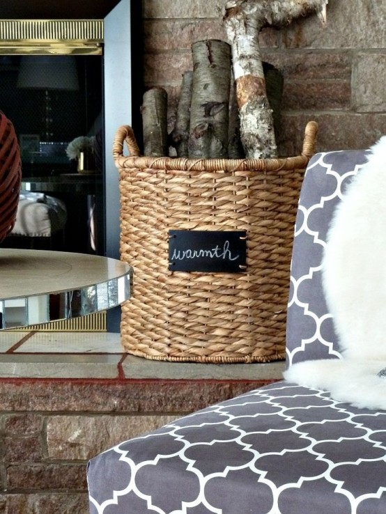 a basket with firewood by a fireplace will add coziness and warmth to any space and will make it cooler