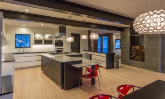 a concrete niche with firewood can substitute a real fireplace in the space adding coziness and a warm feel to the space