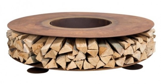 a rust metal round table with firewood is a cool idea for indoors and outdoors, it will add a rustic and an industrial feel to it