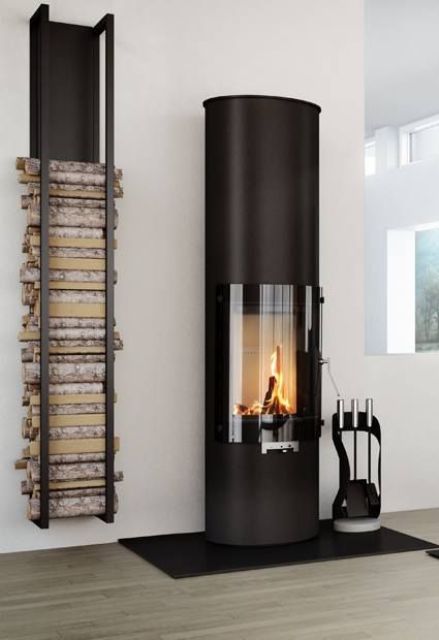 a modern and chic firewood holder attached to the wall is a perfect fit for a modern hearth and looks very laconic and stylish