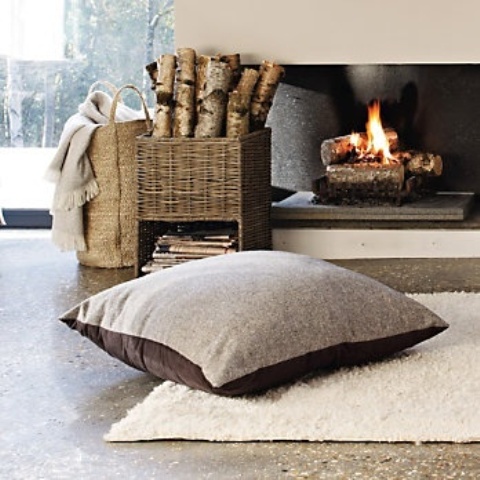 a basket-like stand with magazines and firewood is a lovely idea for a modern or contemporary space