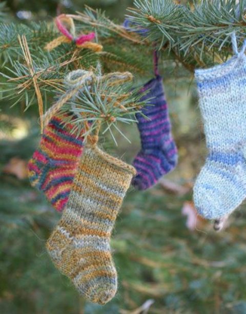 little colorful knit stockings can be used as Christmas tree ornaments and can be suspended in many other place