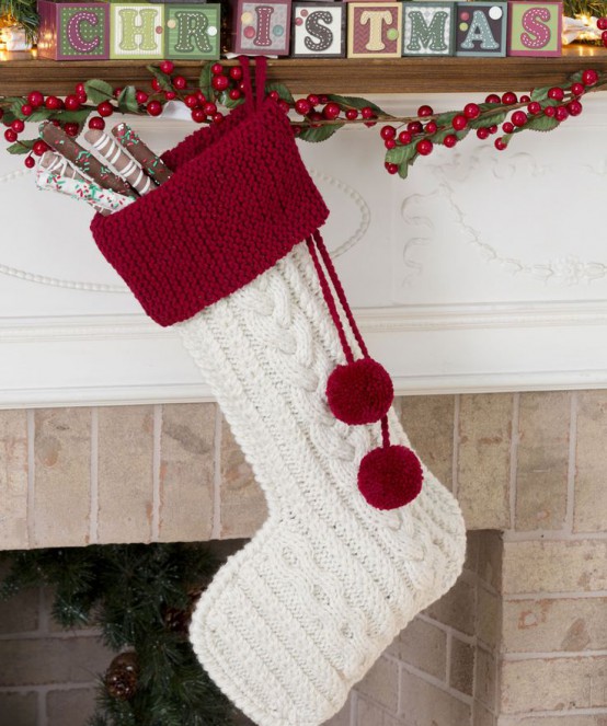 a large knit stocking in traditional Christmassy colors and with large pompoms is always a good idea if you enjoy traditional holiday decor