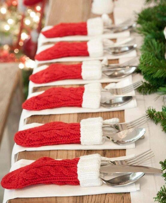 red braided stockings with white faux fur are the cutest cutlery pockets ever that will add a cozy and fun touch to your table