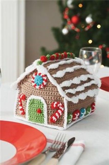 a knit gingerbread house with colorful detailing is a very cute and fun plush toy for Christmas that can be used for decor