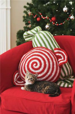 pretty red and white and green and white pillows styled as traditional Christmas candies are fun and cool