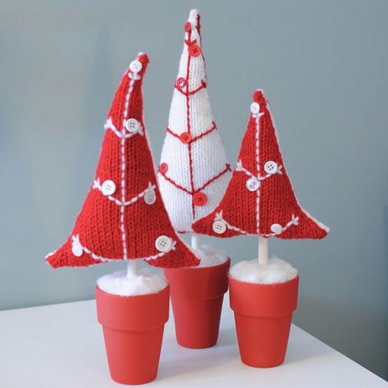 red planters with red and white knit mini Christmas trees decorated with matching buttons are cute and non-typical Christmas decorations