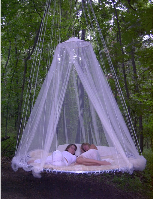 a floating bed with a mosquito net over it is a cool idea to avoid any bugs in your garden while napping here