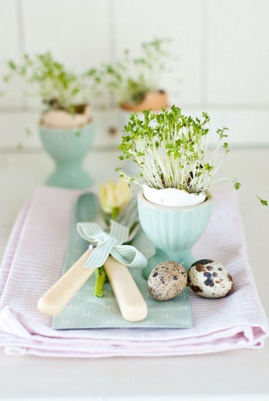 Shades of pale blue, tulips, birds' eggs, and sweet herbs planted in egg shells create a pretty Easter table place setting idea. easter decor - spring decorating ideas - easter table - place setting