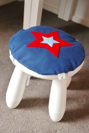 a white IKEA Mammut stool with a bright star pillow on top is a fun idea to spruce up any space