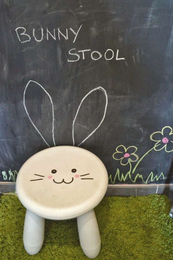 a white IKEA Mammut stool with a drawn bunny face - you can also add ears if you want