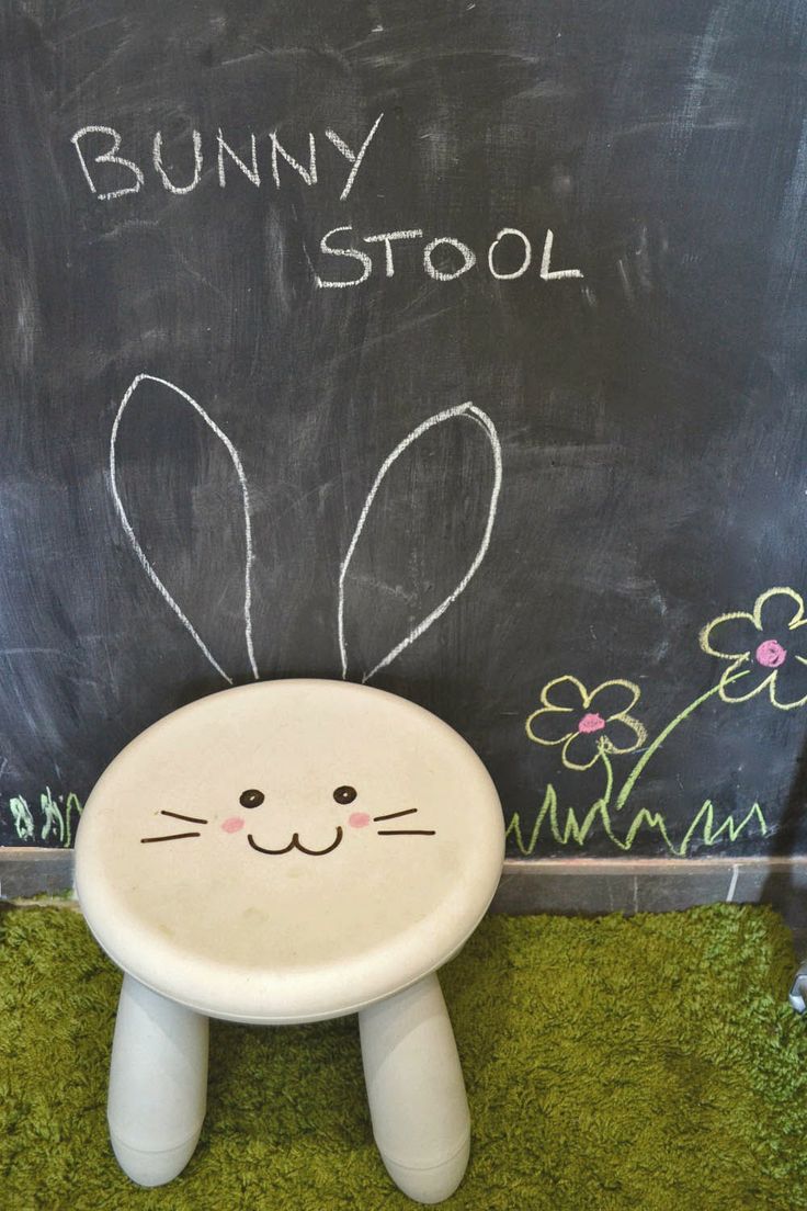 a white IKEA Mammut stool with a drawn bunny face   you can also add ears if you want