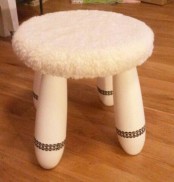 cover IKEA Mammut stools with a fur coverup and spruce up the legs with ribbons for a catchy and cozy look