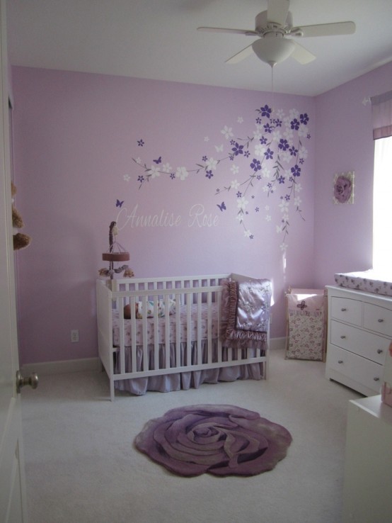 a romantic white and lavender nursery with a white IKEA Sundvik crib, florals on the floor and walls