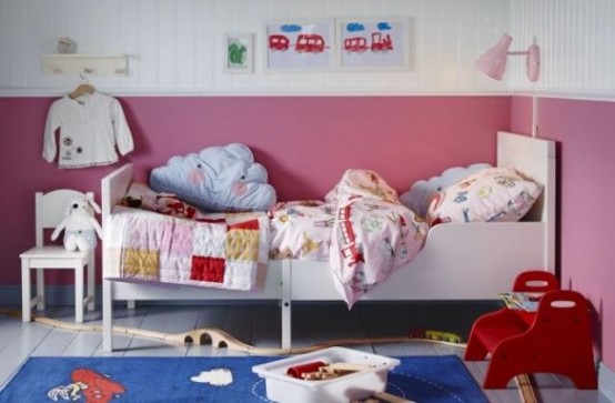 a white IKEA Sundvik bed is a base for this colorful nursery in red, pink and blue