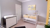 a cozy pastel nursery with lavender walls, yellow touches and an IKEA Sundvik crib integrated perfectly