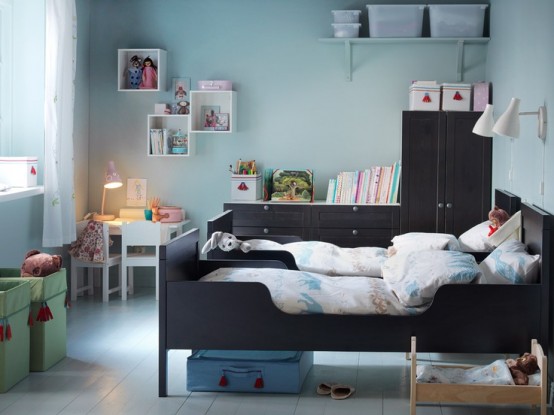 a shared pastel blue nursery with dark stained furniture and IKEA Sundvik beds plus some white items