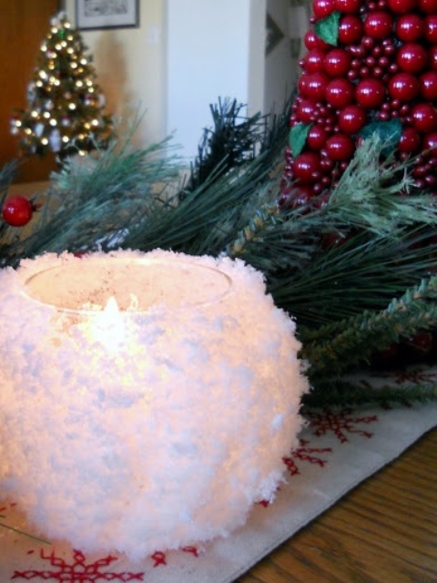 a candleholder styled as a snowball is a very lovely and cool decoration for a rustic or farmhouse space