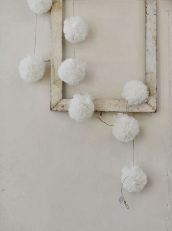 a frame with white snowballs is a shabby chic decoration for Christmas
