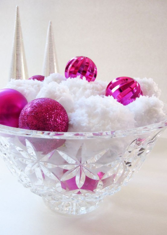 a crystal bowl with fluffy snowballs, hot pink ornaments is a cute and simple Christmas centerpiece to rock