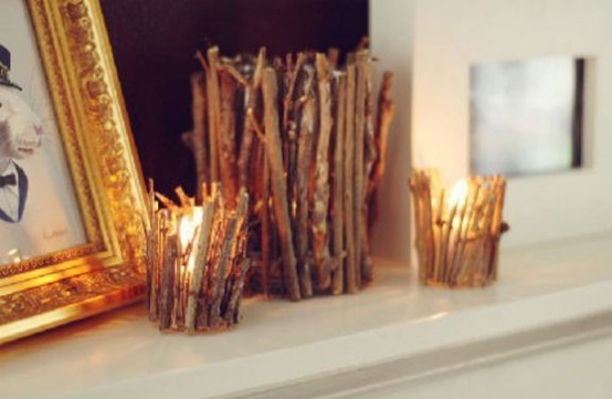 candleholders covered with twigs and sticks for a fall woodland touch in the space