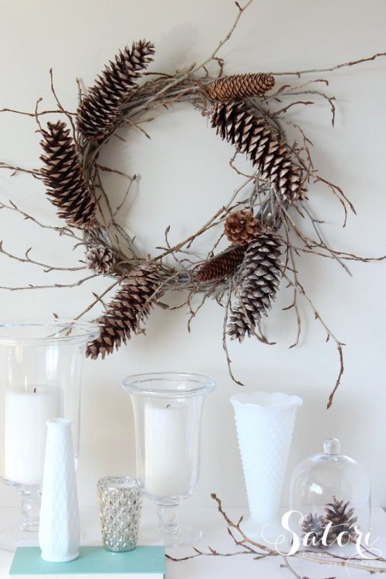 a vine and twig wreath with pinecones is a lovely and all-natural fall to winter decoration