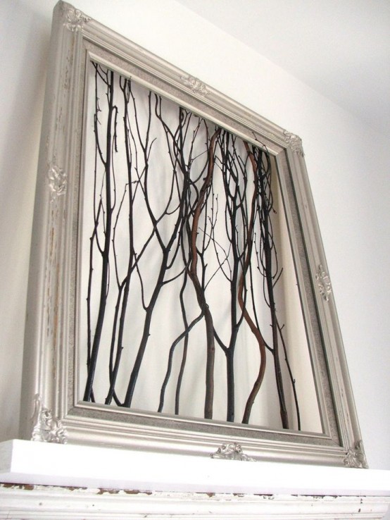 a silver frame with twigs and sticks is a cool decoration with a touch of woodland and glam