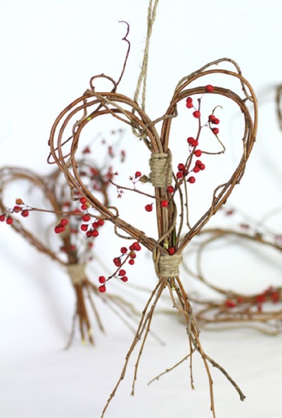 a branch and twig heart wreath with berries and twine is a cool fall decoration to go for