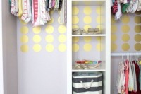 a stylish closet with lots of open storage compartments and clothes hangers is a fun idea with a glam touch
