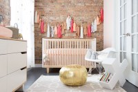a brick wall is a stylish idea for a nursery