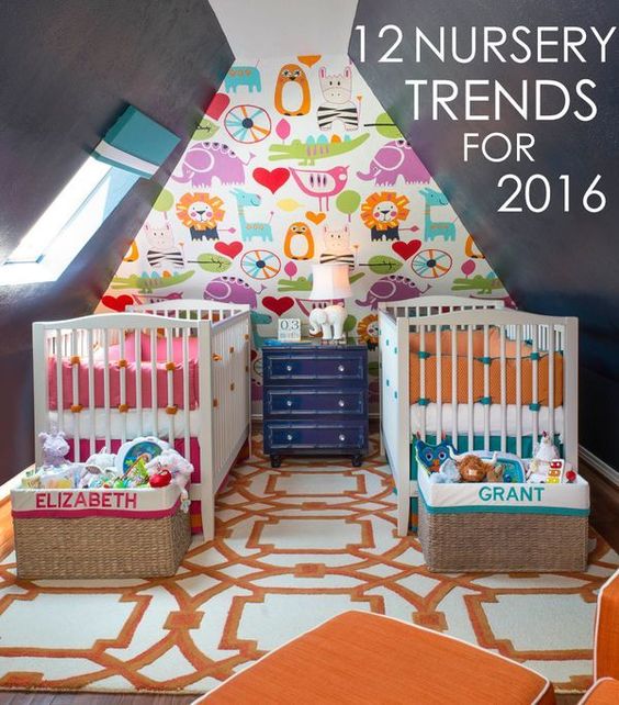 a colorful shared nursery with chalkboard walls, a colorful accent wall, bright bedding and lots of toys