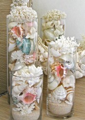 jars and tall vases filled with corals and seashells is a lovely idea for a coastal home, and they can be placed anywhere